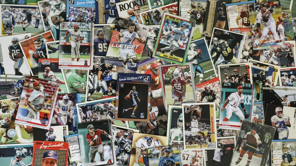 Vintage baseball cards arranged on a dark wooden table