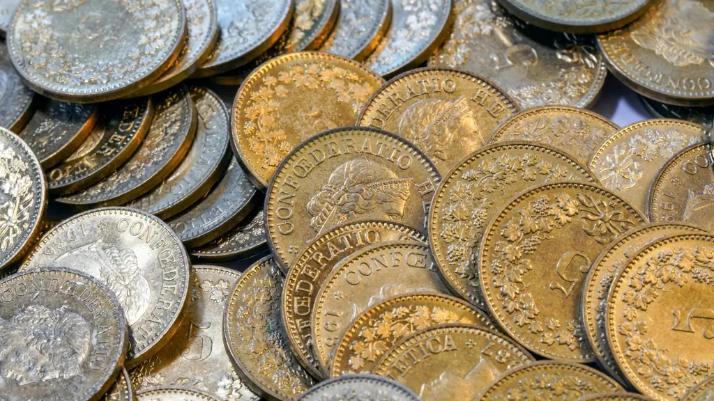 Close-up of a pile of old gold and silver coins